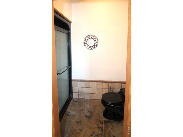 Property Photo 34 Primary bath shower and toilet room