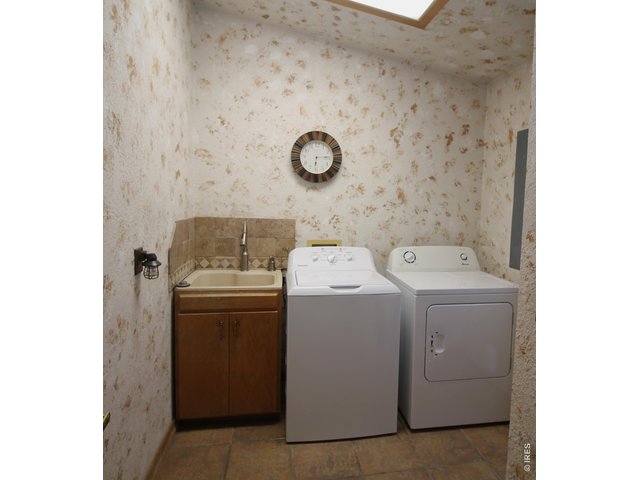 Property Photo 13 Laundry and 1/2 bath off kitchen
