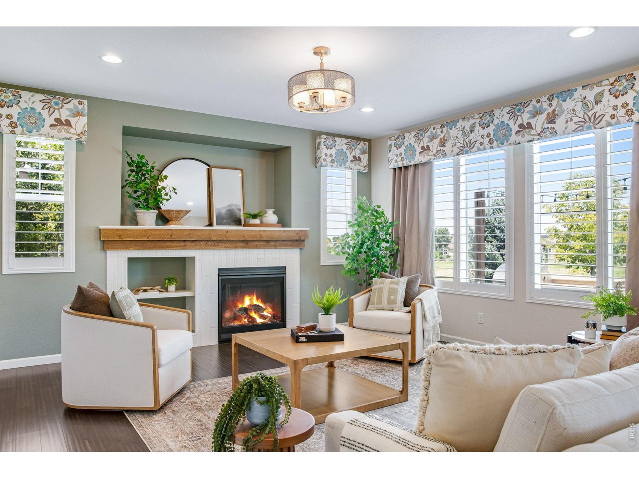 Property Photo 13 Family room with gas fireplace and custom mantel, hidden doggie door, custom center light plus 4 can lights