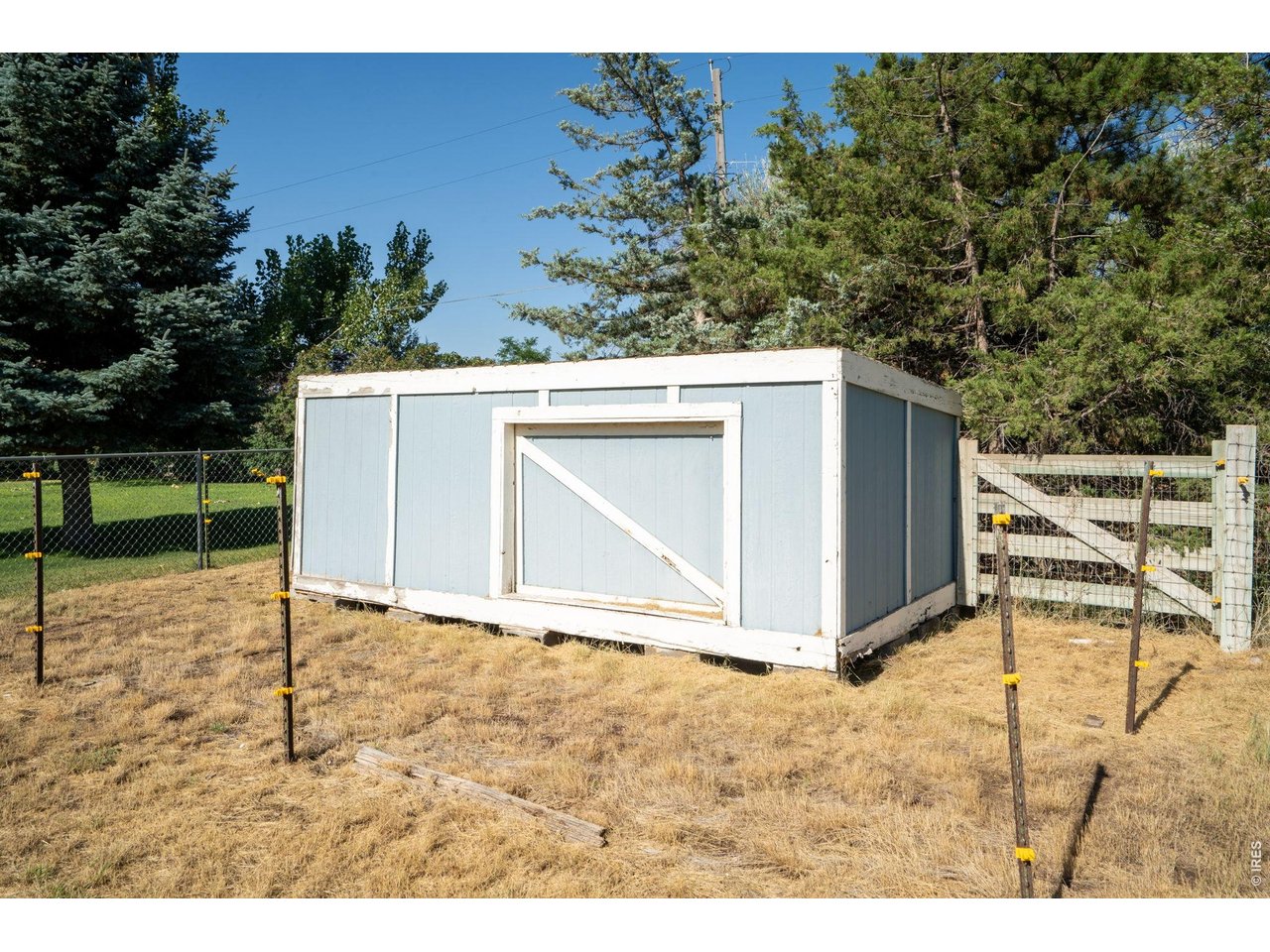 Property Photo 18 This storage shed on the SW corner of the property has been deemed unsafe and will be removed prior to closing. Please do not access this structure.