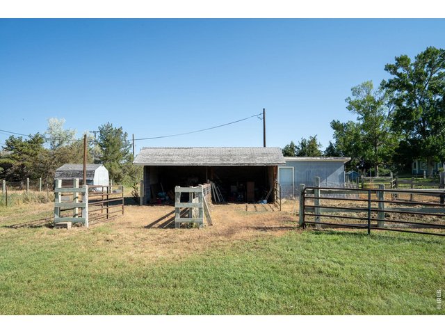 Property Photo 3 Loafing shed with 2 corrals and attached storage building.