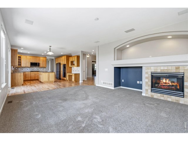 Property Photo 10 Large Family Room with Gas Fireplace and Art Niche