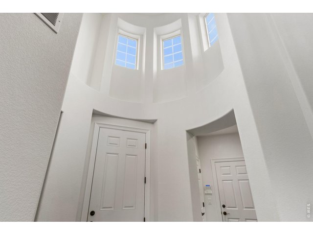 Property Photo 7 Dramatic home entry with Rotunda Windows add beauty and charm.