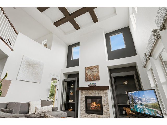 Property Photo 9 Faux Beams drape the ceiling, adding beauty to the great room.