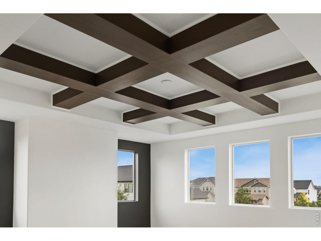 Property Photo 10 Faux Beams in great room, shown from second story view, with windows that add wonderful natural light.