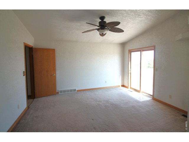 Property Photo 27 Primary bedroom with door to patio