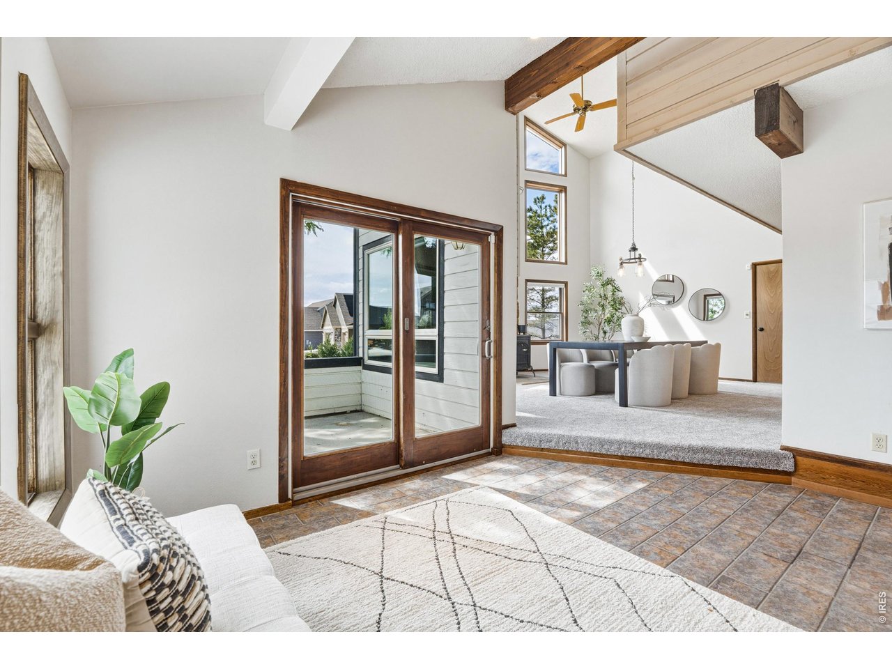 Property Photo 5 Abundant natural light pours into the main living area, highlighting the home's unique architectural lines.