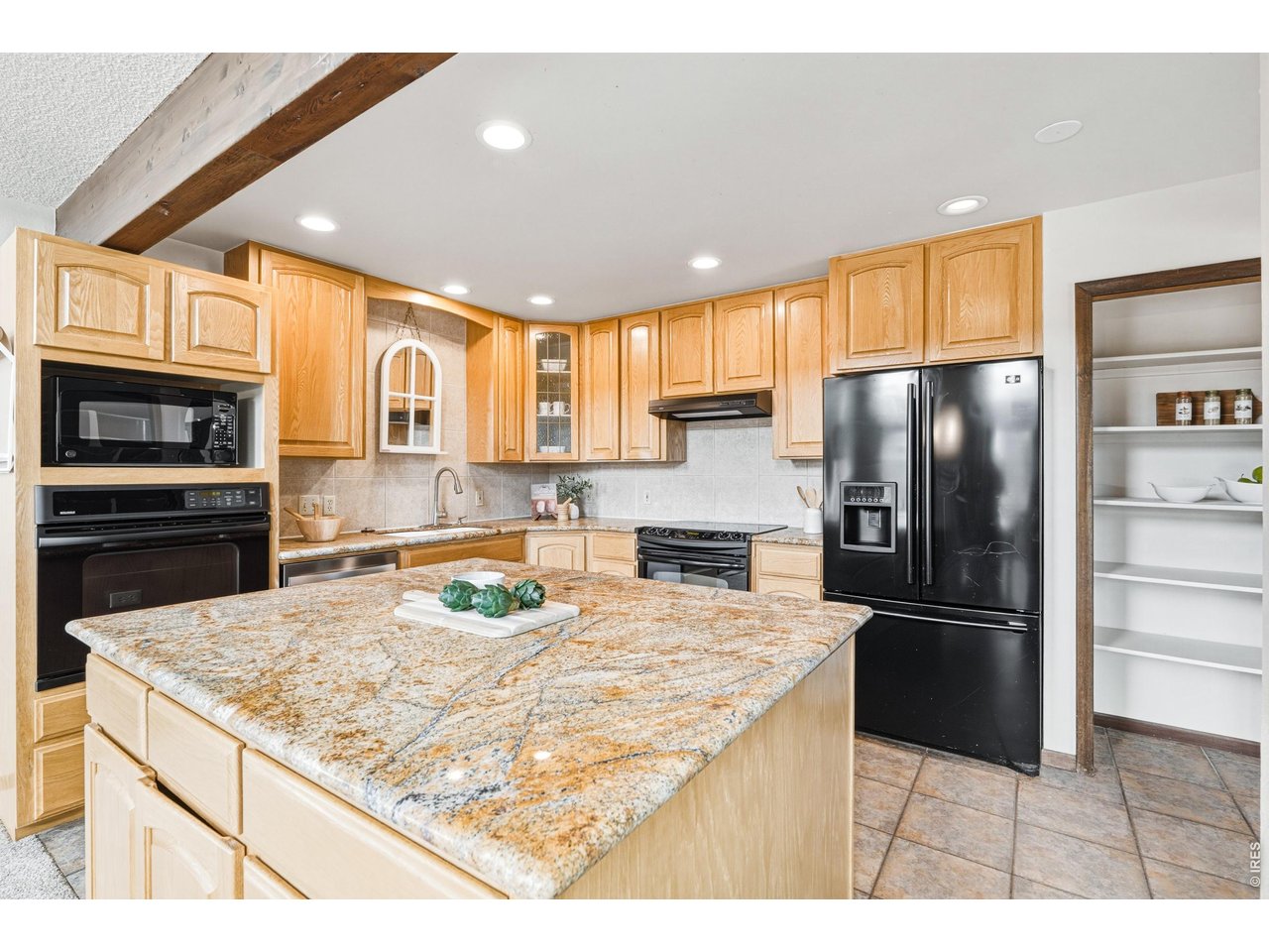 Property Photo 16 Spacious kitchen with granite center island.
