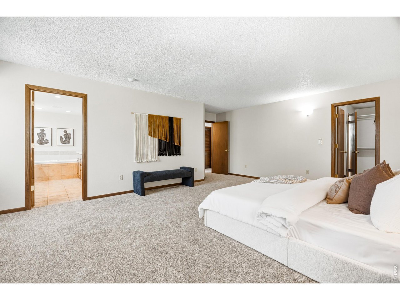 Property Photo 22 Primary suite with direct access to ensuite bath and walk-in closet.