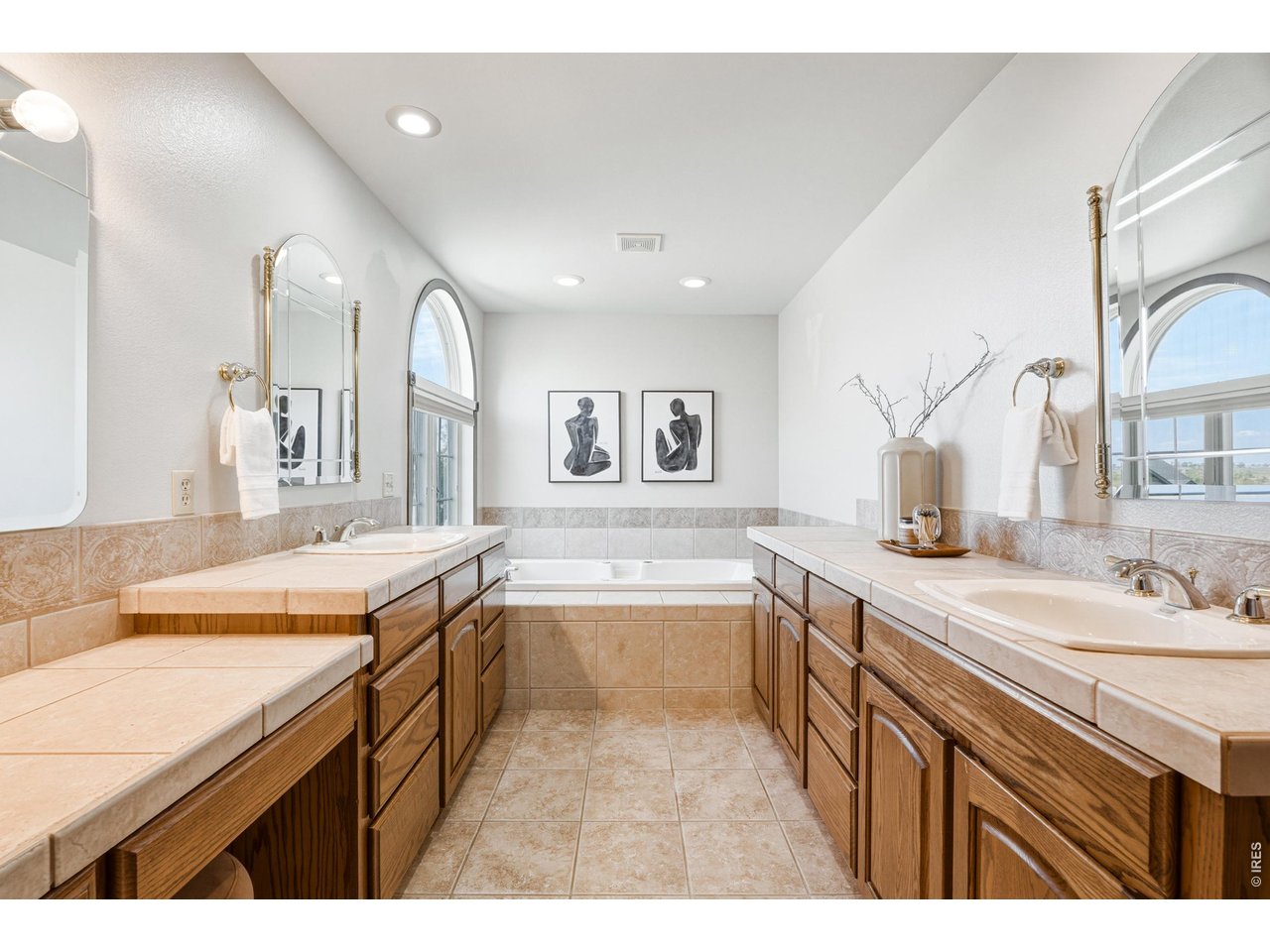 Property Photo 23 Spacious ensuite bath with dual vanities and soaking tub.