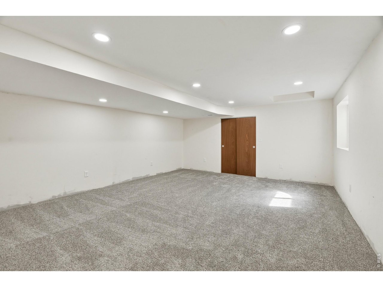Property Photo 47 Basement bedroom with natural light and generous space for guests, home office or work out space.