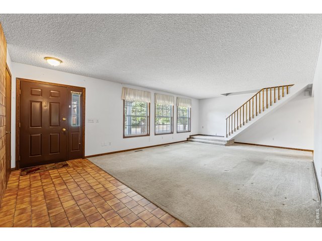 Property Photo 7 Living Room with stairs going to the loft and 3rd bedroom