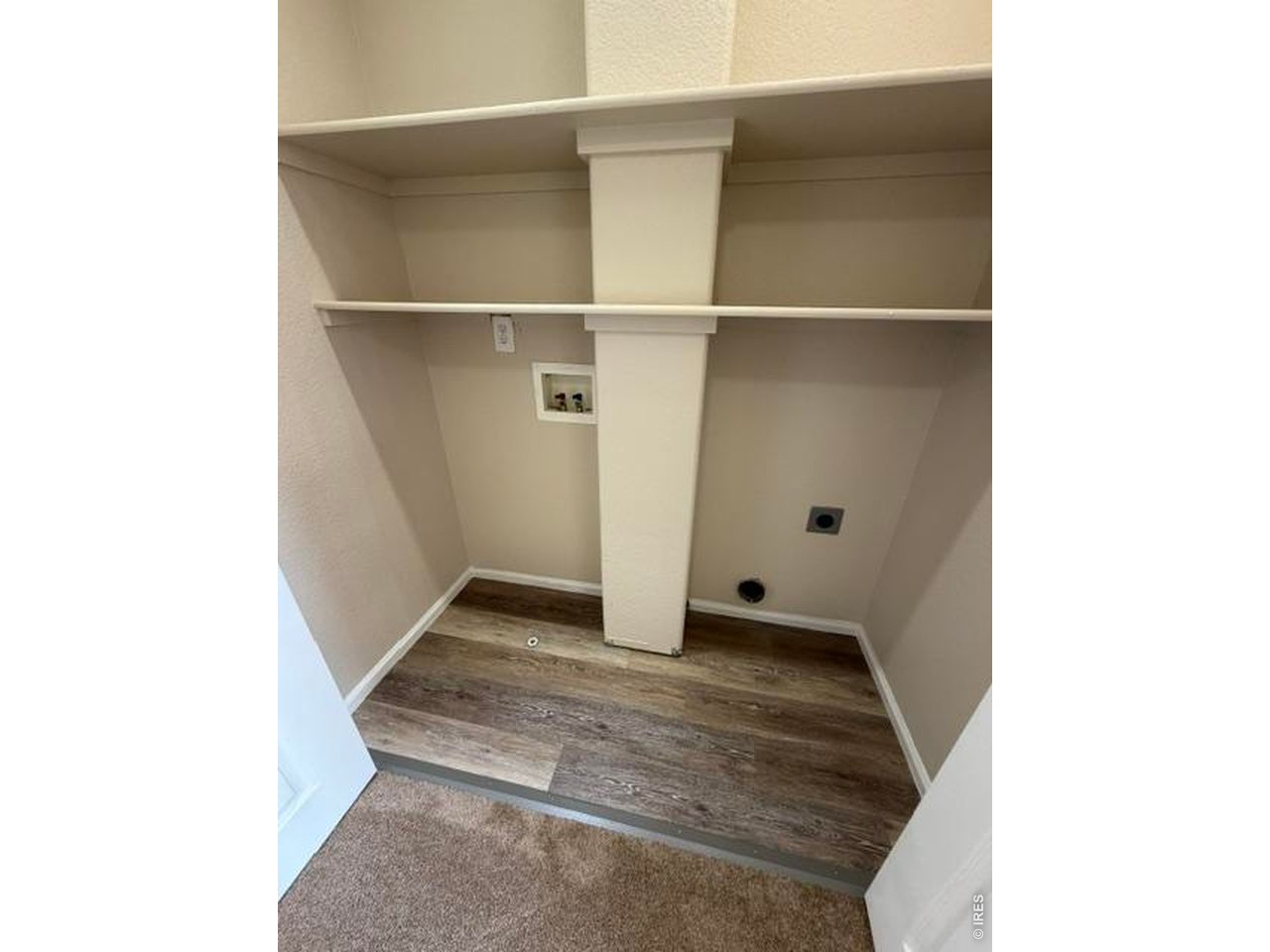 Property Photo 15 Upstairs laundry is conveniently located by the bedrooms