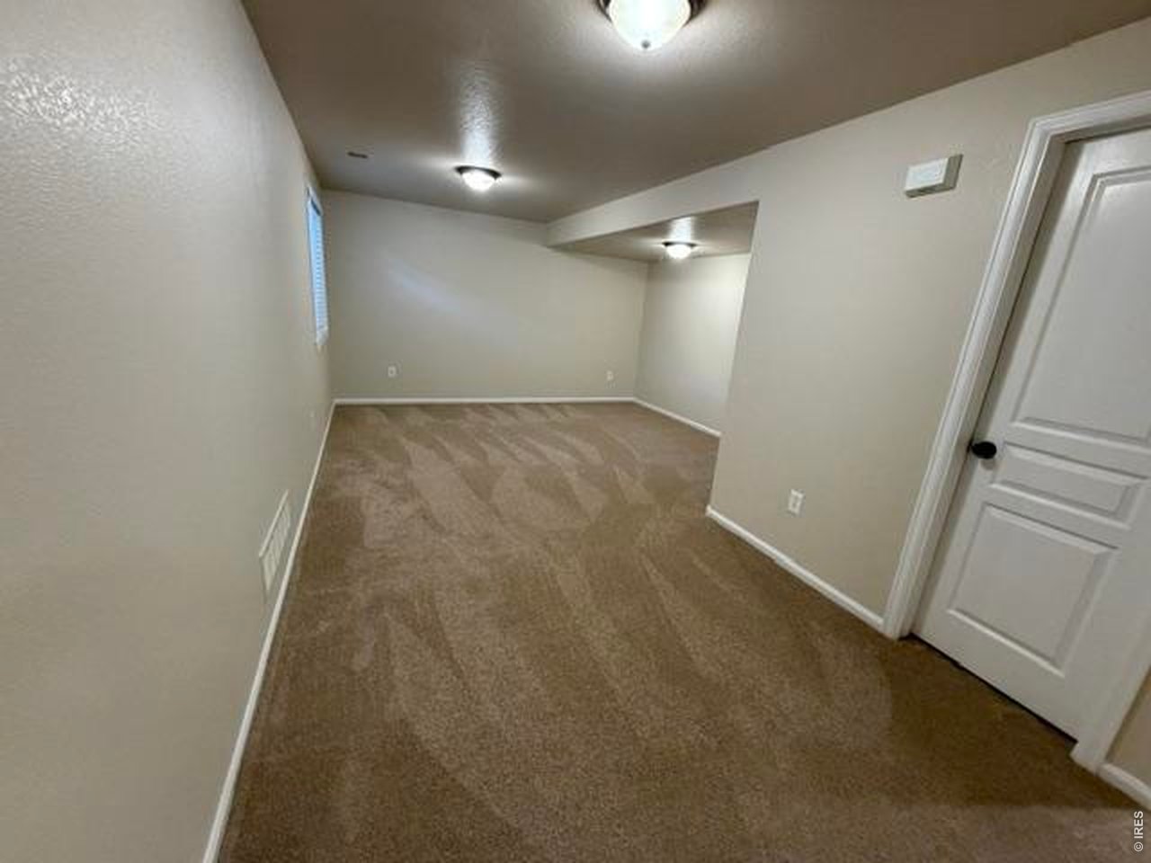 Property Photo 16 Lots of room in the basement family room to hang and create memories and fun