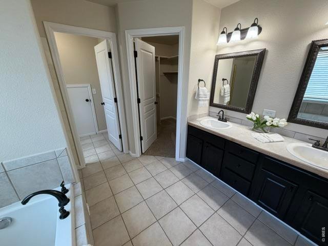 Property Photo 10 Primary Suite 5-piece bath with large walk in closet