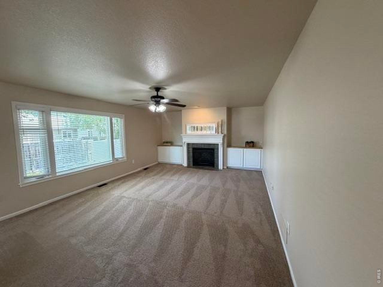 Property Photo 6 A large family room invites you in to create a welcoming space for family and friends to gather