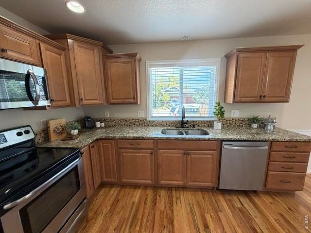 Property Photo 3 Stainless steel appliances and plenty of storage with pantry and cabinets