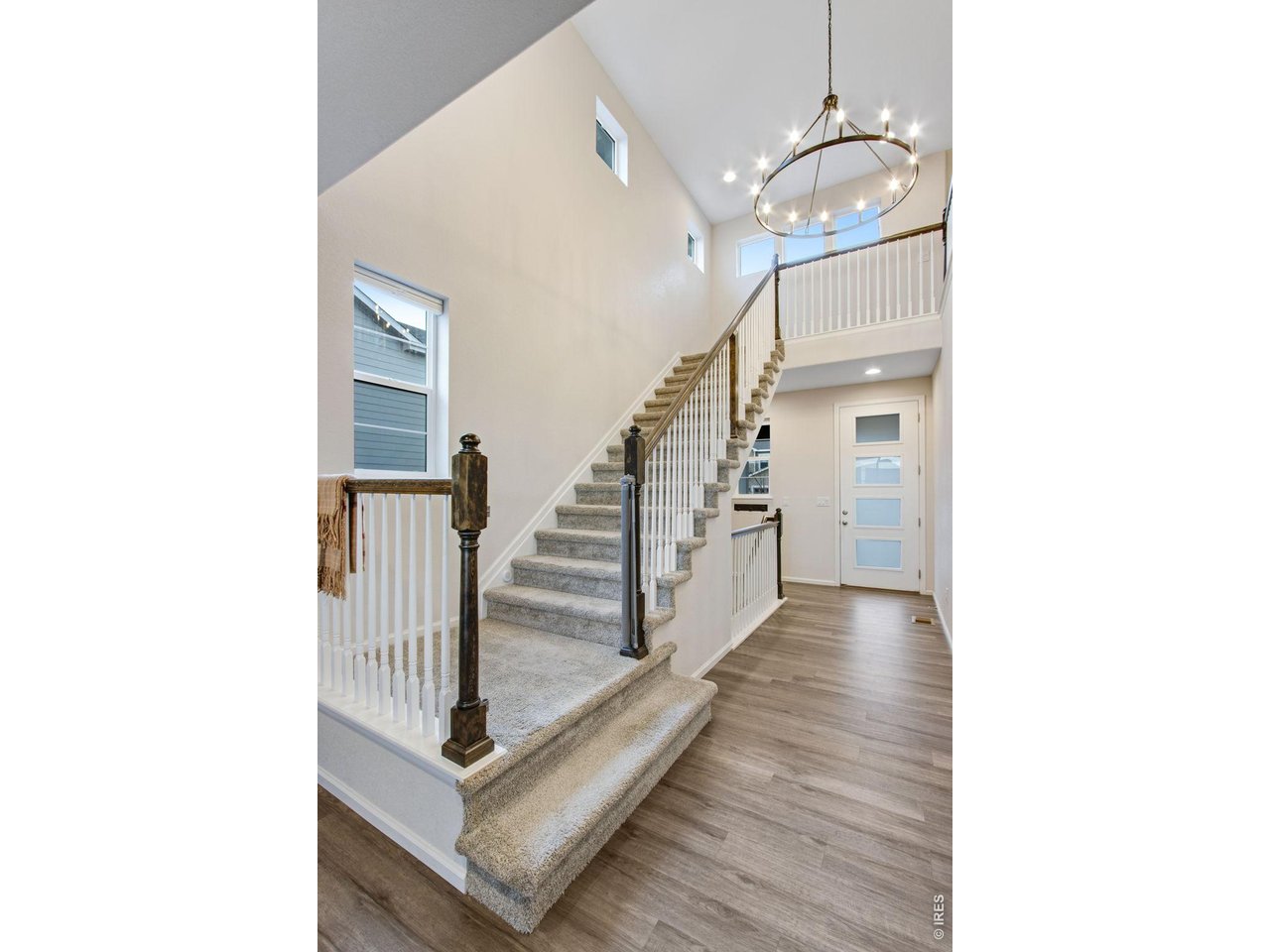 Property Photo 3 Grand entry with vaulted ceilings and chandelier