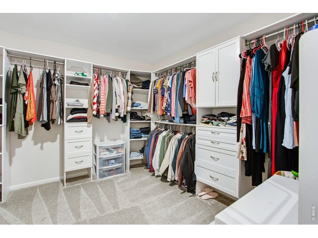 Property Photo 25 Primary closet with upgraded shelving