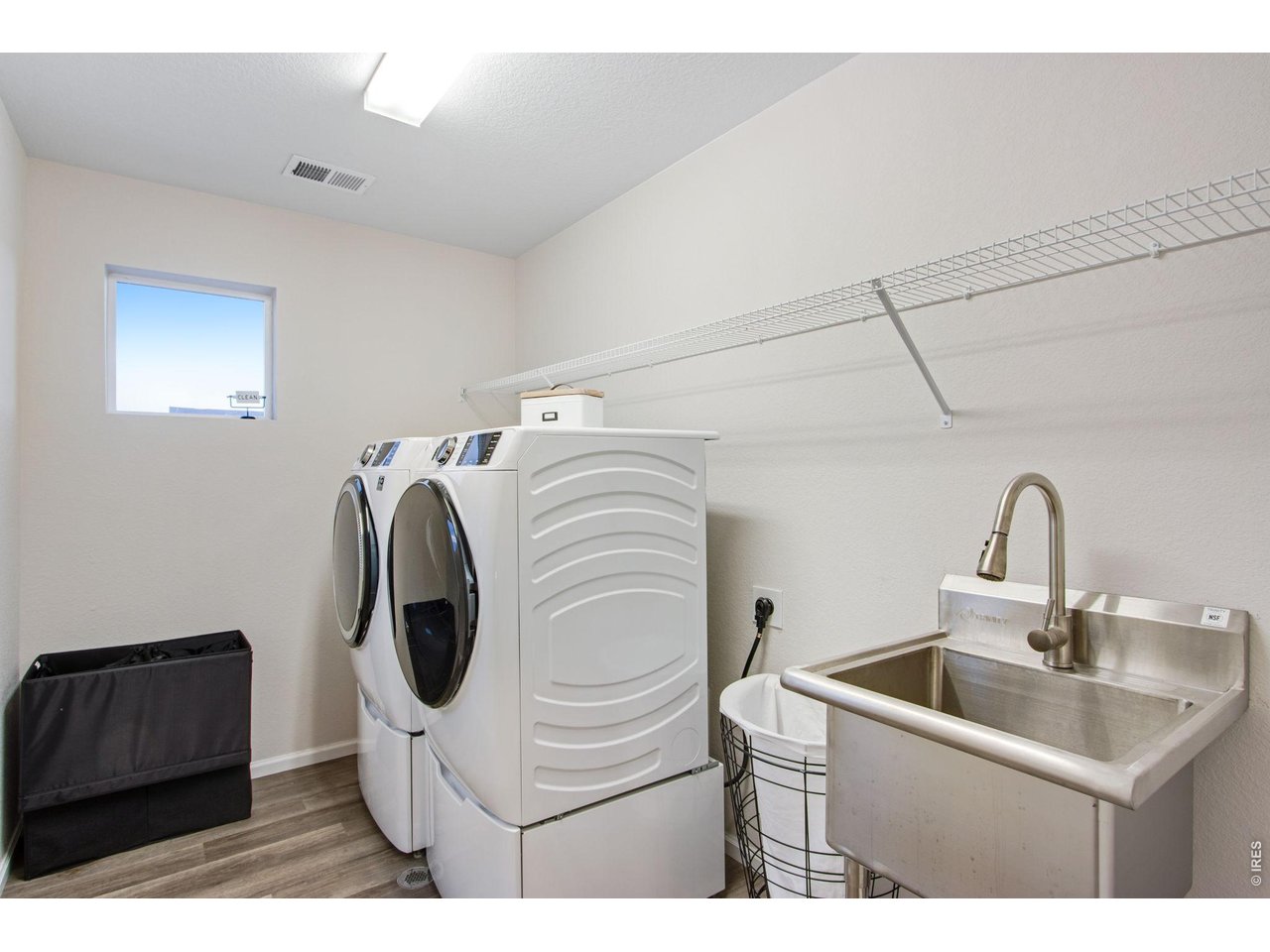Property Photo 26 Upstairs laundry room with utility sink