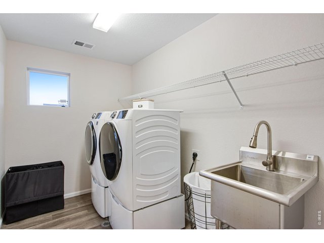 Property Photo 26 Upstairs laundry room with utility sink