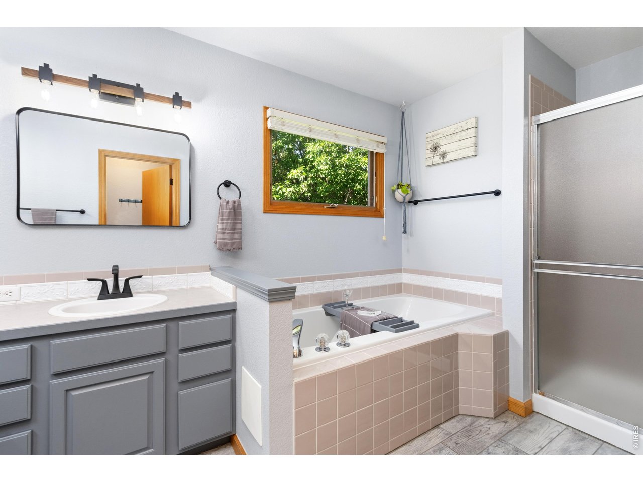 Property Photo 24 5-piece primary bathroom with updated fixtures