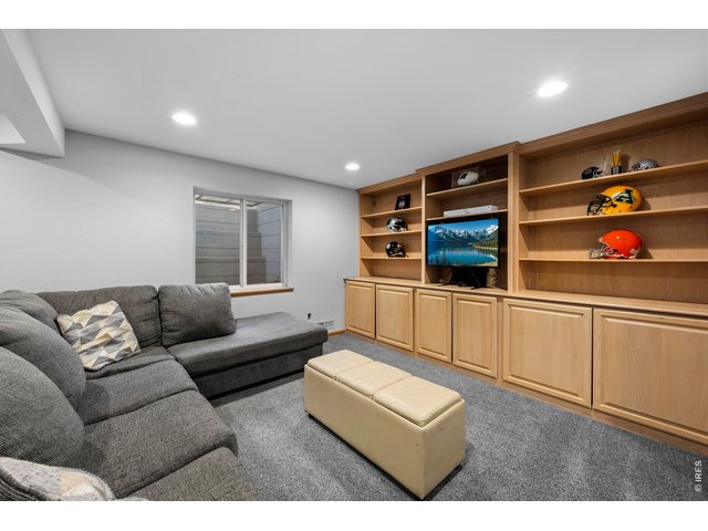 Property Photo 33 Fully finished basement with rec room, bar area/workspace, and additional bedroom and bathroom