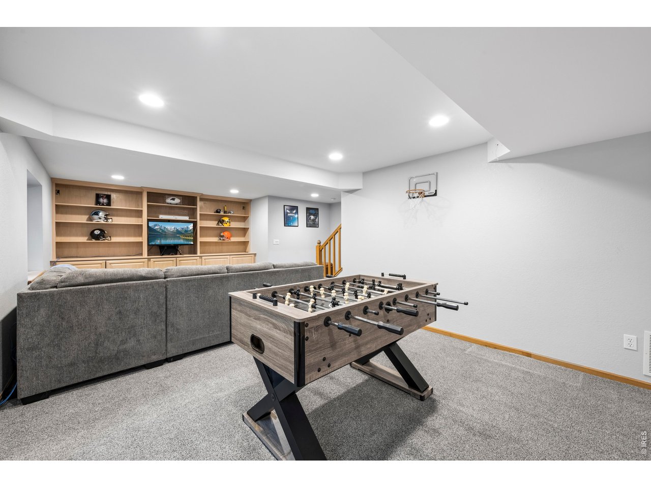 Property Photo 34 Fully finished basement with rec room, bar area/workspace, and additional bedroom and bathroom