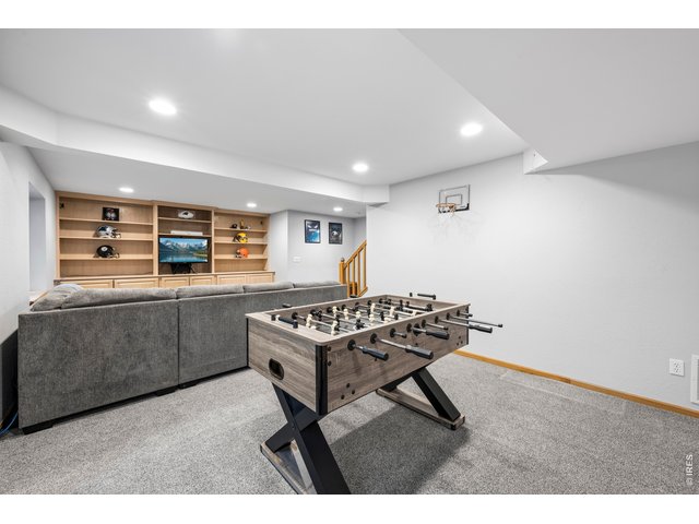 Property Photo 34 Fully finished basement with rec room, bar area/workspace, and additional bedroom and bathroom