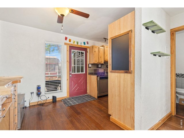 Property Photo 9 Updated kitchen with stainless appliances including a nearly new refrigerator. Hardwood cabinets!