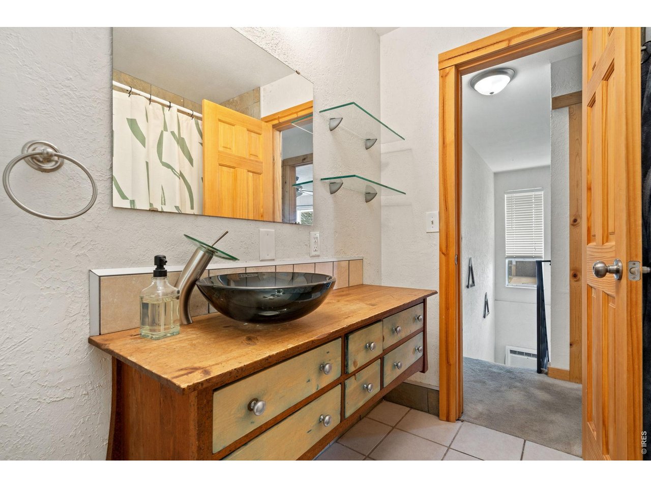 Property Photo 14 Upstairs bath. Remodeled with custom vanity.