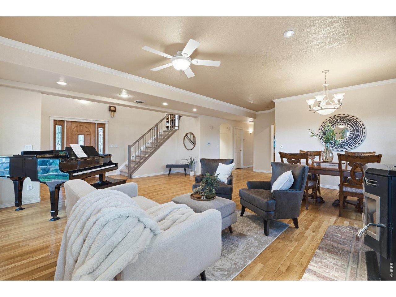 Property Photo 8 The open main level flows from entry to living and dining, with stairs to the upper level.