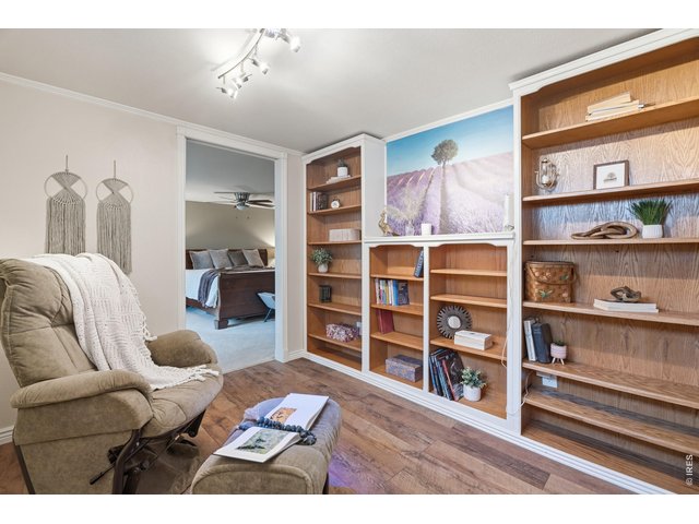 Property Photo 17 Flex space with built-in shelving opens into the primary suite.