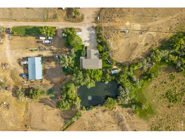 Property Photo 44 Directly overhead: the home, pond, and equipment building on 10.3 acres.