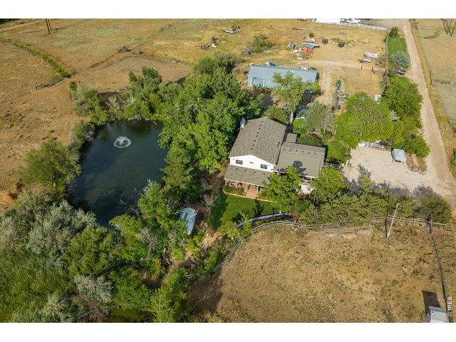 Property Photo 3 The property from above - home, water, pasture, and shop.