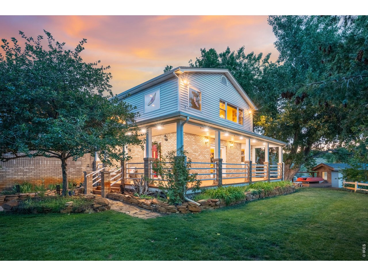 Property Photo 48 Dusk on the wrap-around porch.