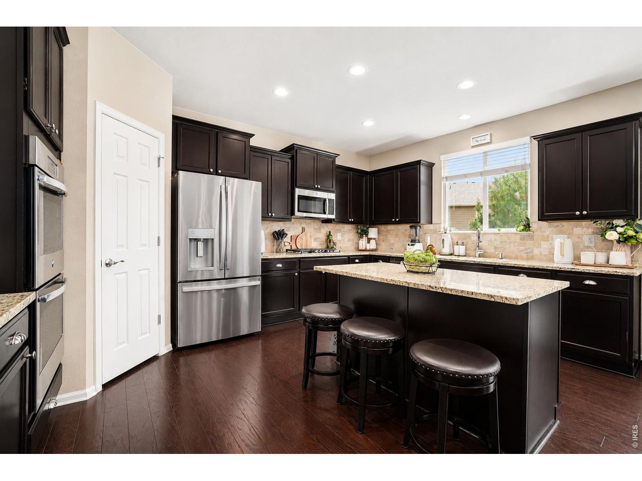 Property Photo 3 Kitchen with island, pantry , double oven and gas cooktop