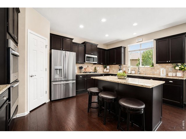 Property Photo 3 Kitchen with island, pantry , double oven and gas cooktop