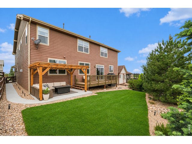 Property Photo 40 Backyard with pergola deck and patio space