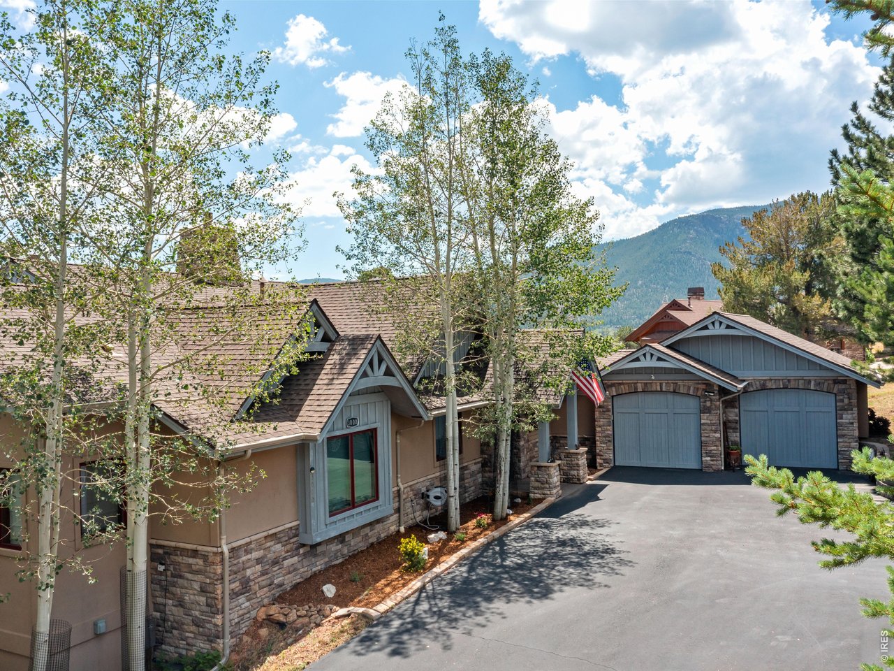 Property Photo 2 Oversized 3-car garage with installed 240V 40A NACS EV charger. Recently repaved driveway with 240V 50A RV receptacle and room for additional vehicles or a convenient turnaround.