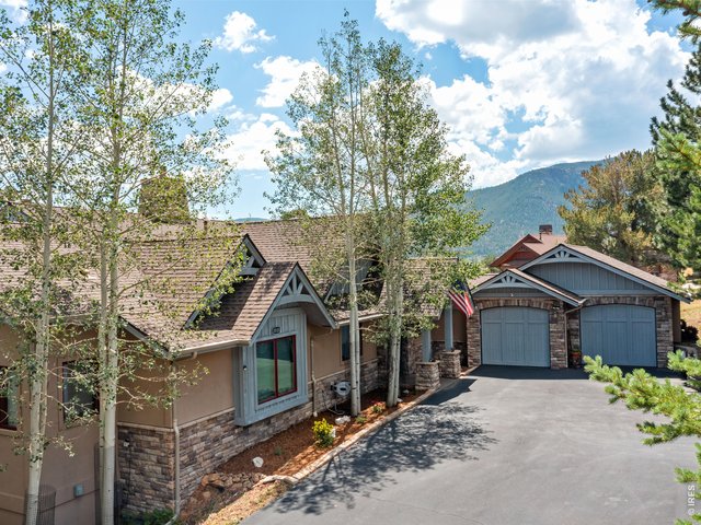 Property Photo 2 Oversized 3-car garage with installed 240V 40A NACS EV charger. Recently repaved driveway with 240V 50A RV receptacle and room for additional vehicles or a convenient turnaround.