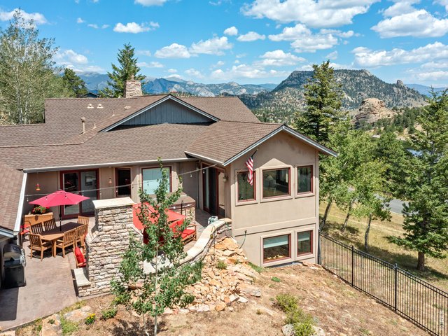 Property Photo 4 The fully enclosed backyard (metal fencing + animal netting) keeps pets secure while larger wildlife stays at a respectful distance. Mature aspens and professional landscaping (with upgraded lighting) create a private, park-like setting.