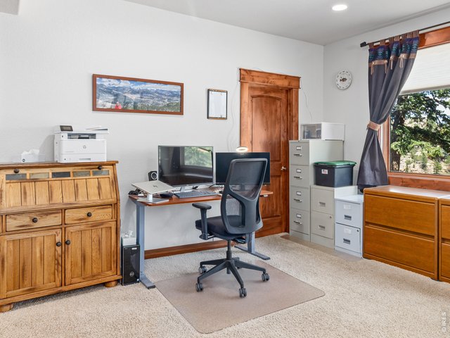 Property Photo 43 More than 900 square feet of unfinished storage offers endless possibilities for a workshop, fitness room, hobby space, or future expansion.