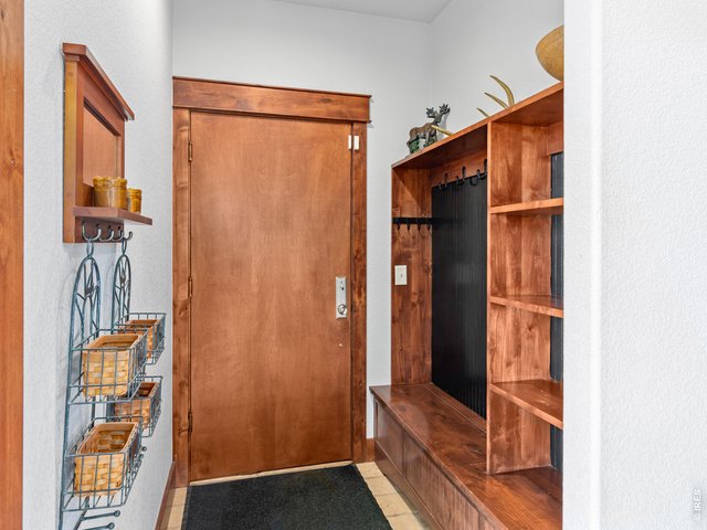 Property Photo 44 A generous mudroom just off the attached 3 car garage provides the perfect drop zone for coats, etc adding everyday convenience & organization as you enter the home.