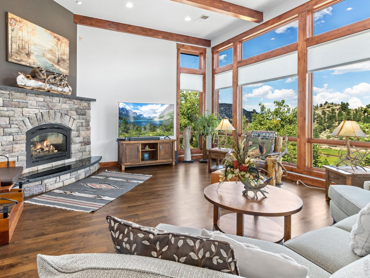 Property Photo 8 Step into a massive, welcoming living room that flows seamlessly into an open-concept kitchen and dining area.