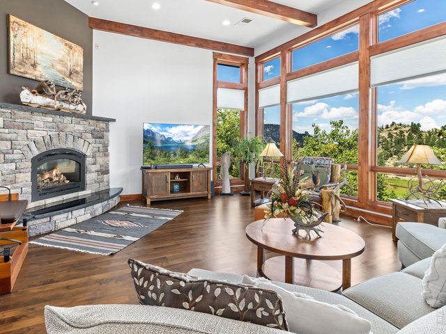 Property Photo 8 Step into a massive, welcoming living room that flows seamlessly into an open-concept kitchen and dining area.