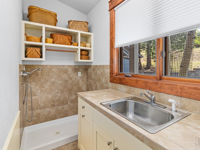 Property Photo 46 Laundry room includes sink and convenient dog wash