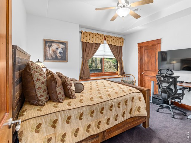 Property Photo 31 A second main-level suite provides exceptional comfort for guests or multi-generational living.