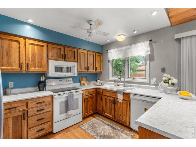 Property Photo 18 Kitchen features walnut cabinets.