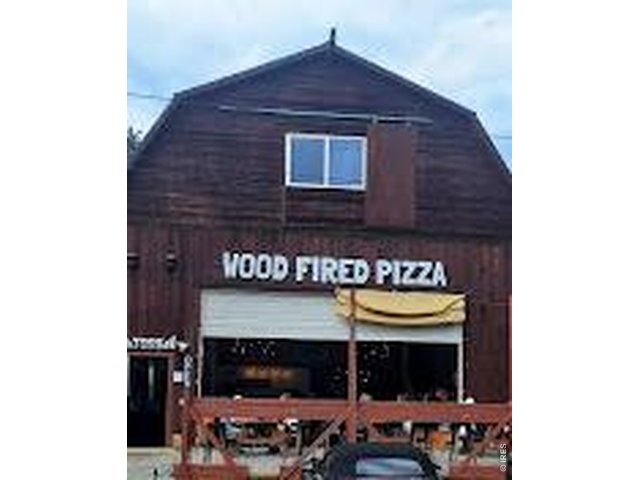 Property Photo 28 Toss Wood Fired Pizza down the street!